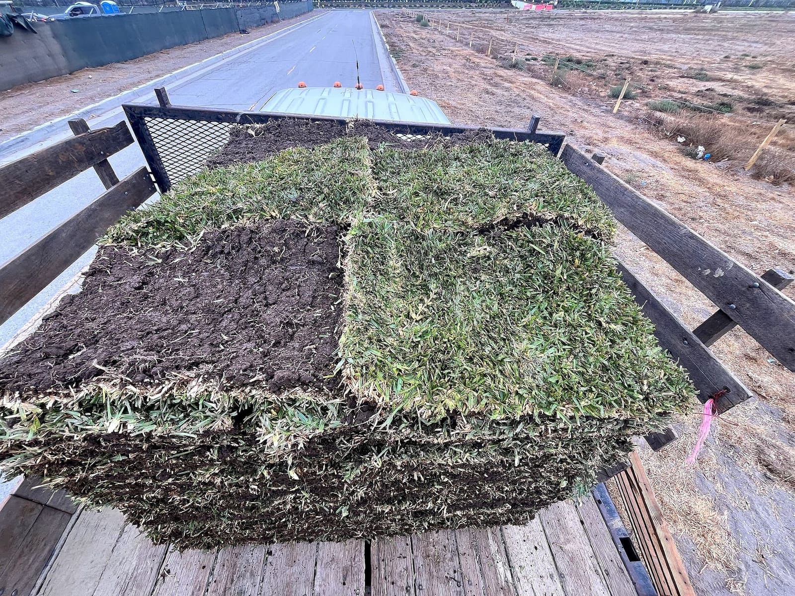 Pallet of sod on a trailer on a desert highway